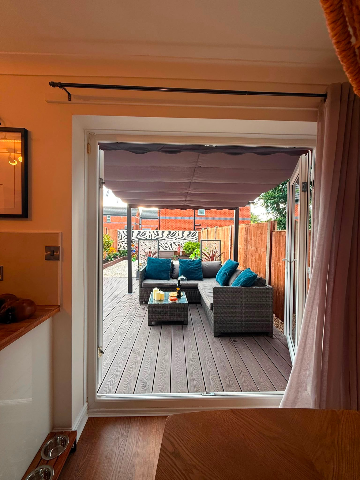 The garden seen through the open patio doors from inside the house